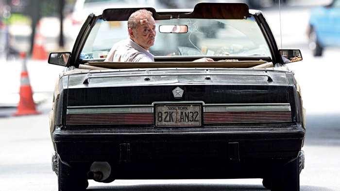 Bill Murray in a convertible car