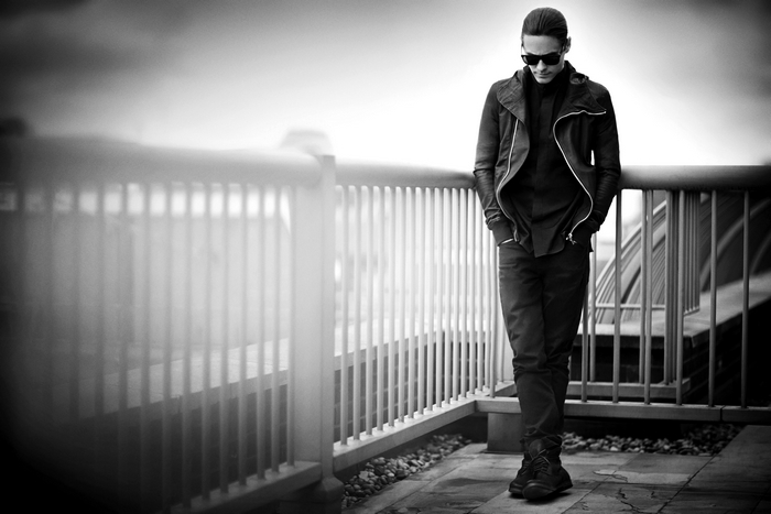 Jared Leto wearing a black jacket and sunglasses