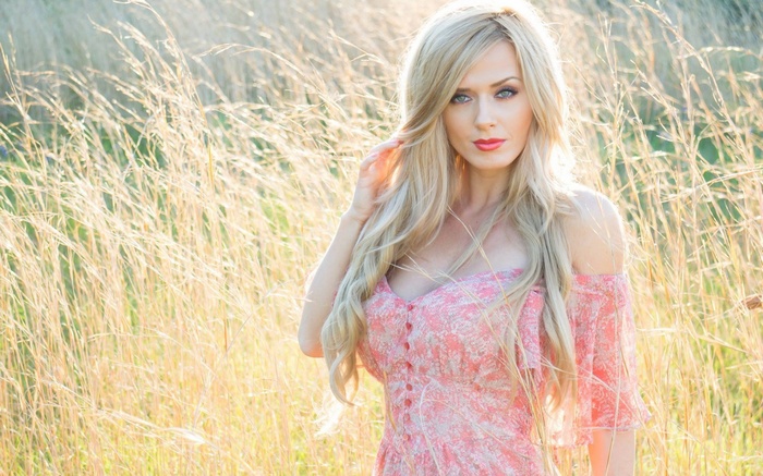 Woman in a field of tall grass