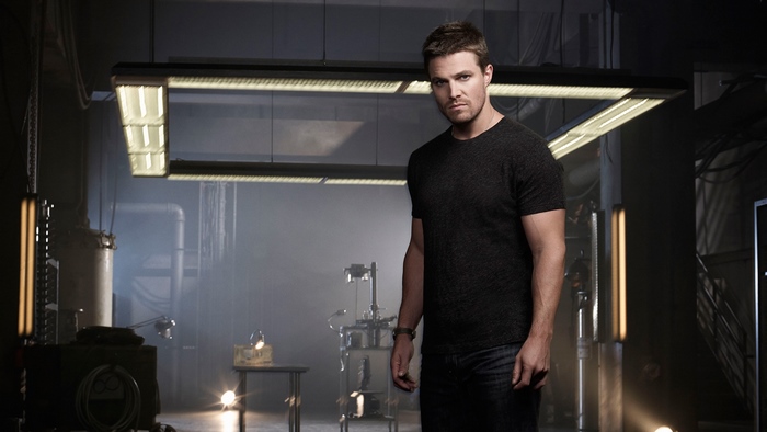 Stephen Amell in a dark room