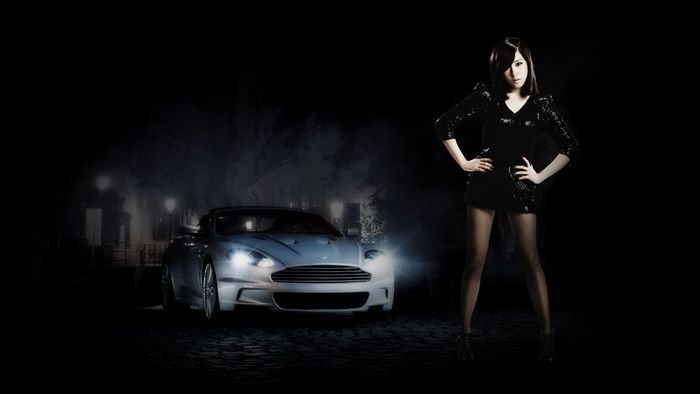 Woman in black dress and Aston Martin car
