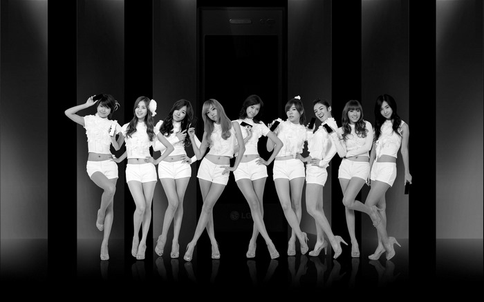 Girls Generation posing in front of LG phone