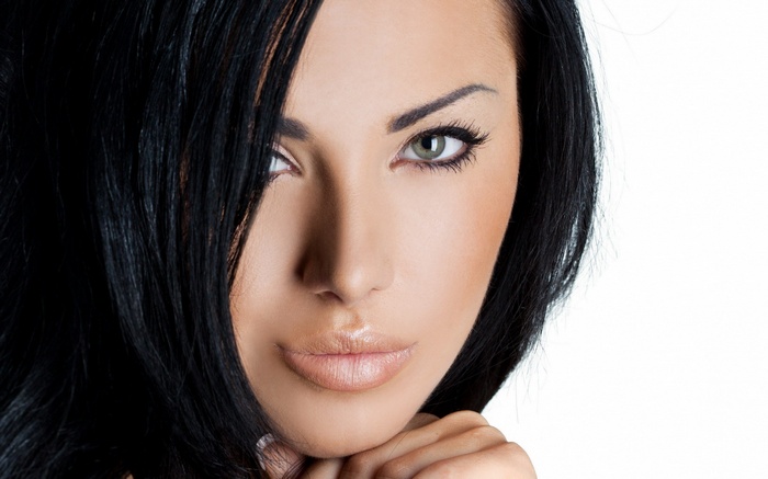 Close-up of a woman's face with dark hair