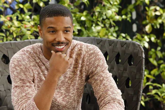 Michael B. Jordan sitting outdoors