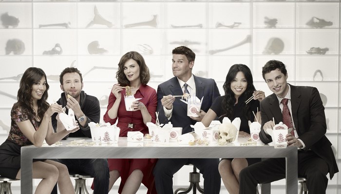 Bones cast eating from takeout containers