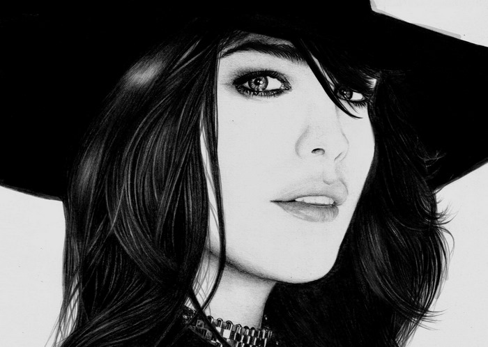 Liv Tyler wearing a black hat