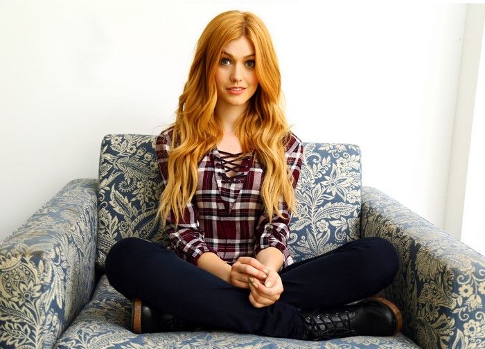 Katherine McNamara sitting in a chair