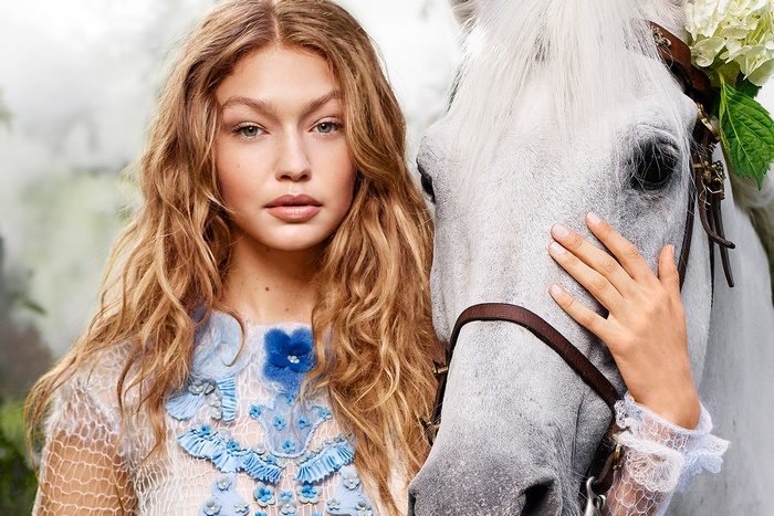 Gigi Hadid with a white horse