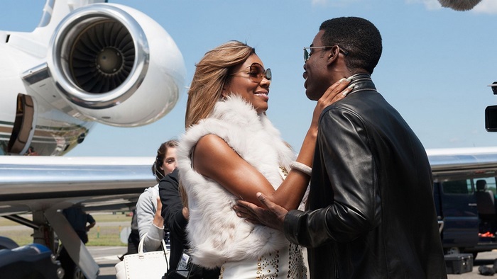 Rosario Dawson and Chris Rock by a private jet