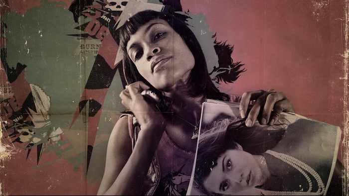 Rosario Dawson holding a magazine