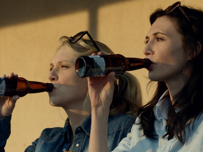 Carice van Houten drinking beer