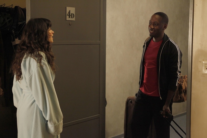 Lamorne Morris and woman by door 4D