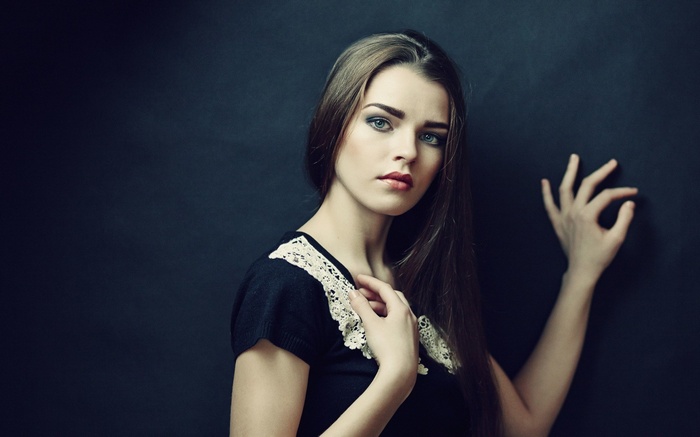 Woman with long brown hair and blue eyes