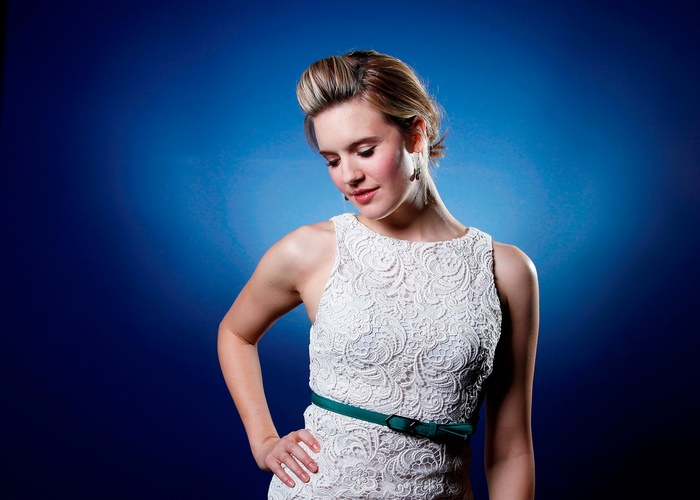 Maggie Grace in white lace dress