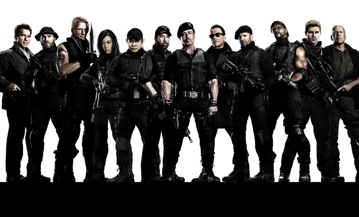 The Expendables cast posing with weapons