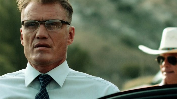 Dolph Lundgren in glasses and a man in a cowboy hat