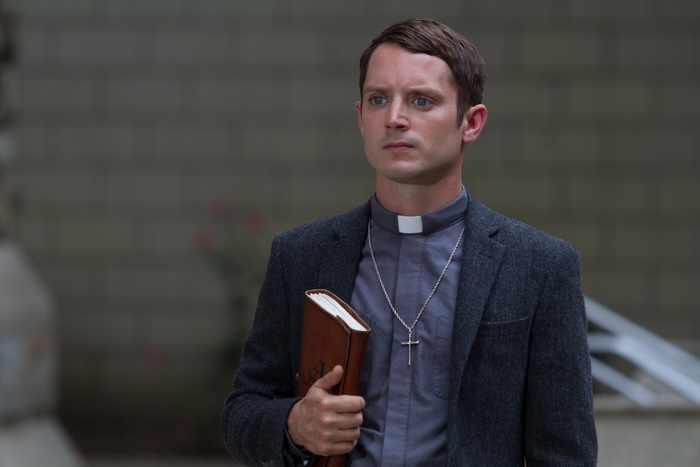 Elijah Wood as a priest