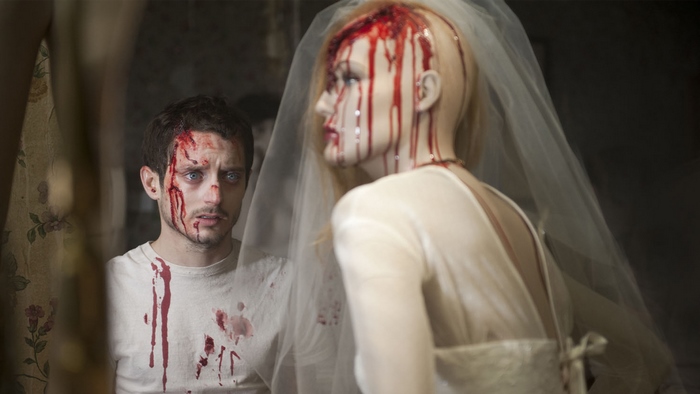 Elijah Wood with bloody mannequin bride