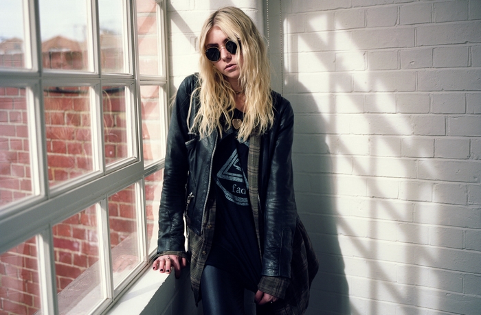 Taylor Momsen by a window