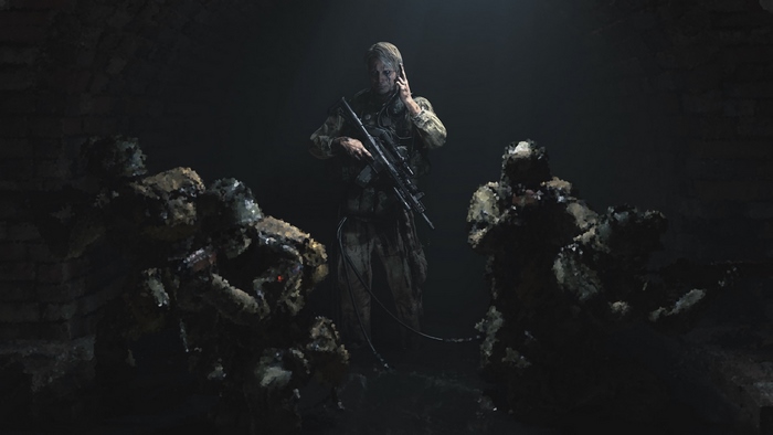 Mads Mikkelsen with soldiers in dark environment
