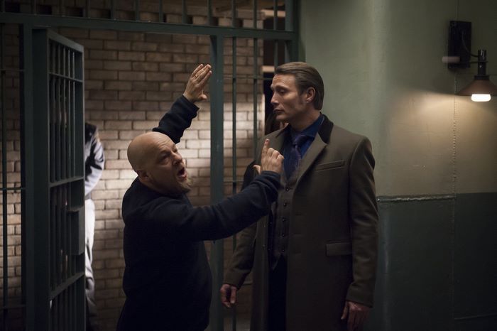 Mads Mikkelsen in a prison setting