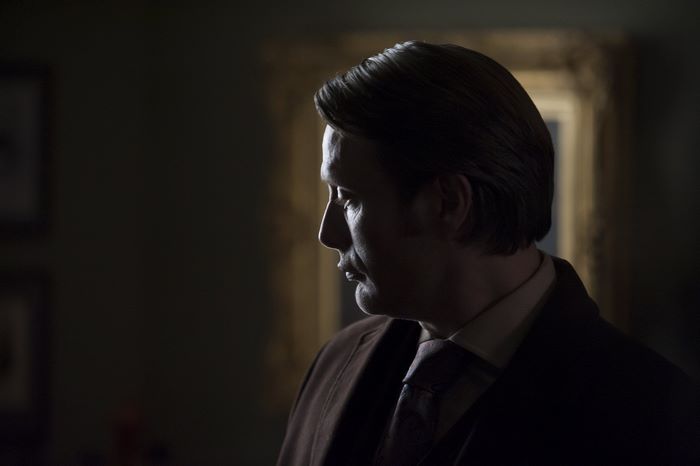 Mads Mikkelsen in a dark room