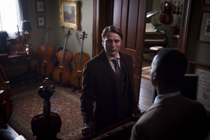 Mads Mikkelsen in a room with cellos