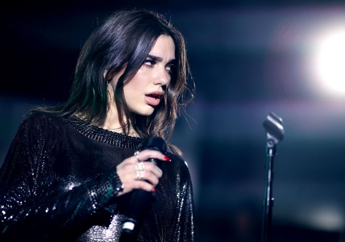 Dua Lipa performing on stage