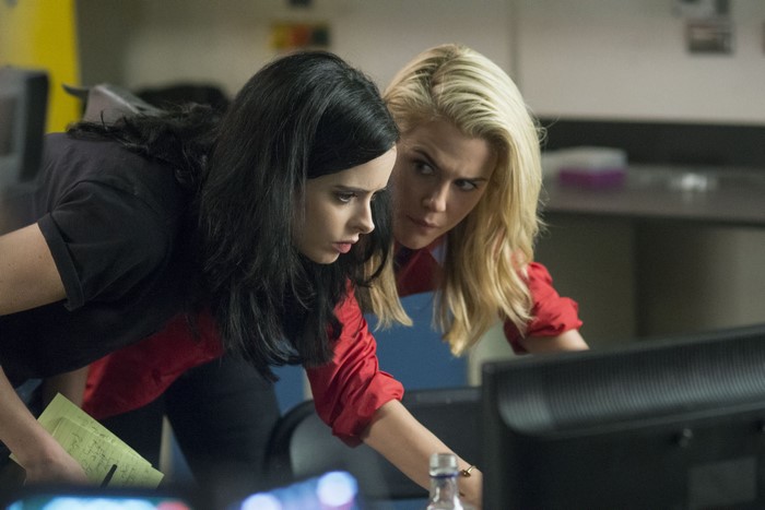 Krysten Ritter looking at computer screen