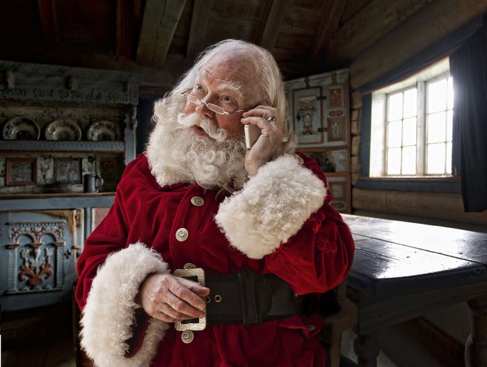 Santa Claus talking on a phone