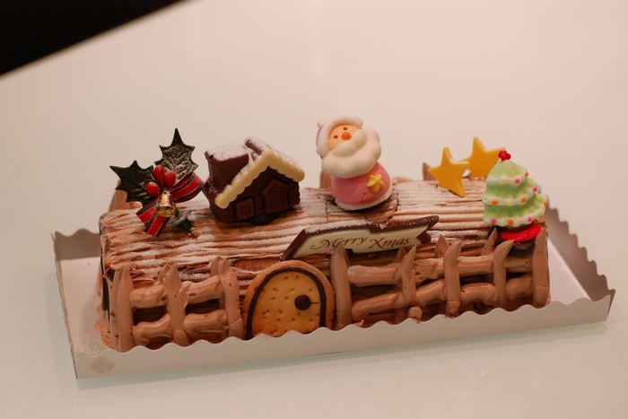 Christmas Yule Log Cake with Santa Claus Decoration