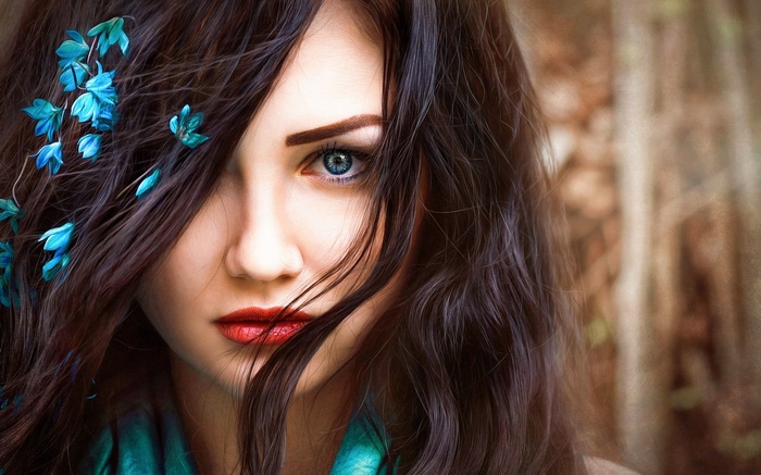 Woman with blue flowers in her hair