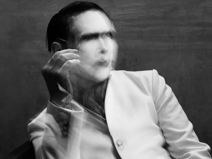 Marilyn Manson in a white suit