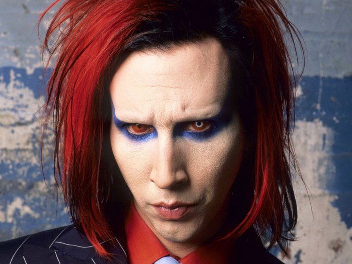 Marilyn Manson with red hair and blue eye makeup