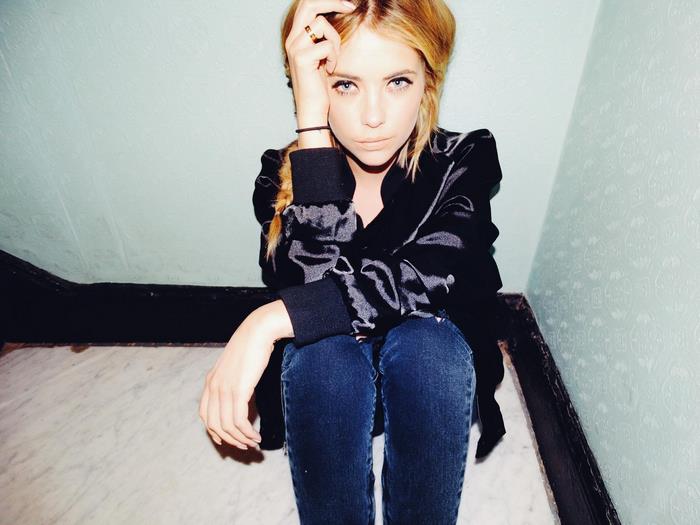 Ashley Benson sitting on stairs