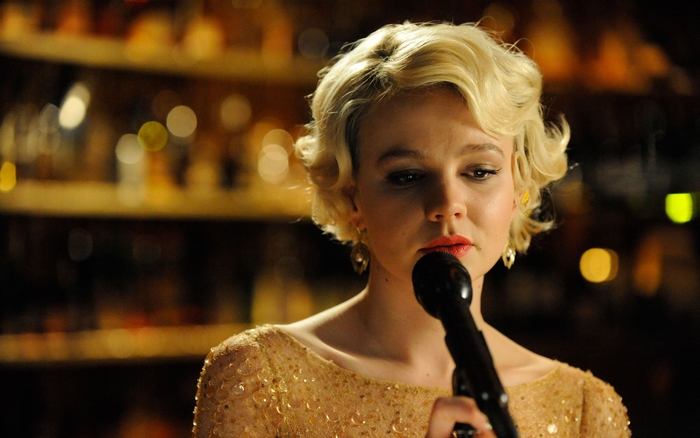 Carey Mulligan singing into a microphone