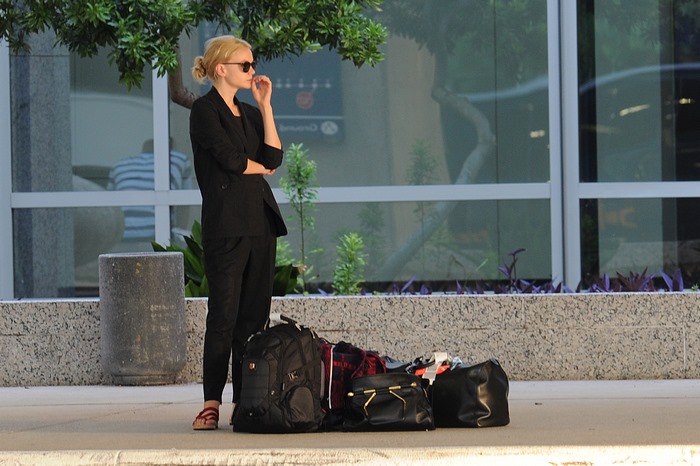 Carey Mulligan with luggage