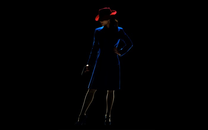Hayley Atwell as Peggy Carter with a gun