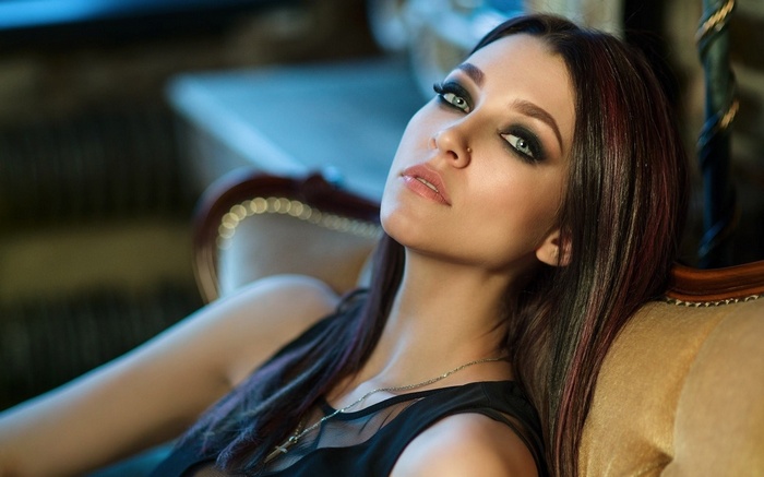 Woman with dark makeup and dark hair