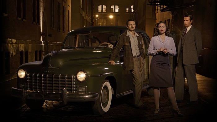 Hayley Atwell and two men with a car