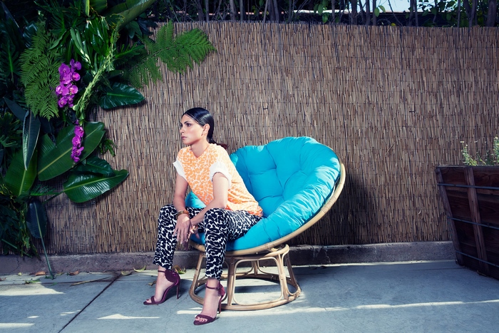 Morena Baccarin sitting in a papasan chair