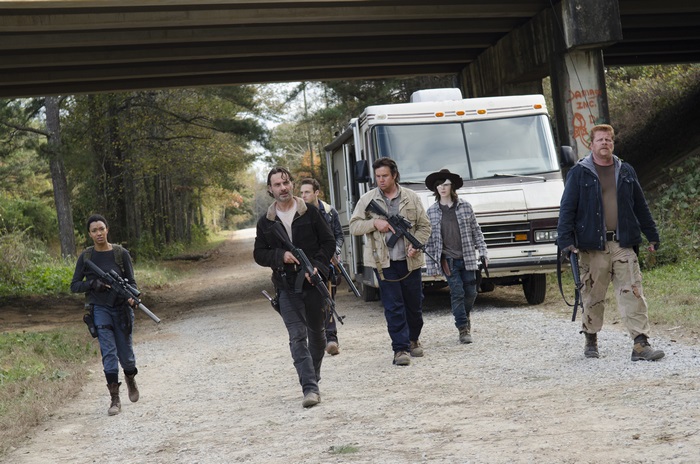 The Walking Dead characters walking on a road