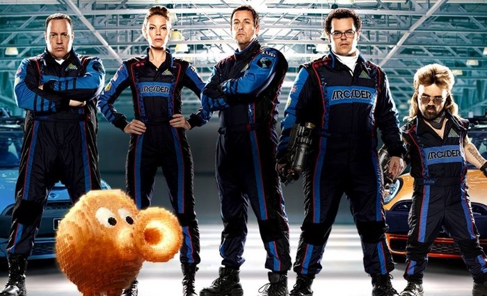 Cast of Pixels posing in racing suits with a character