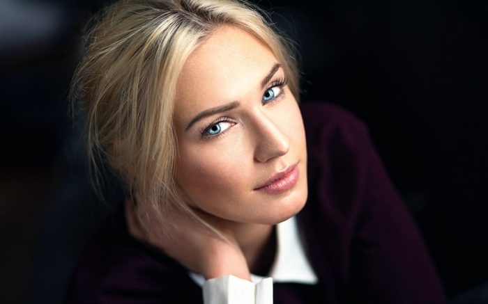 Woman with blonde hair and blue eyes
