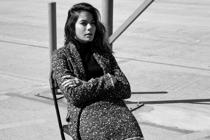 Michelle Monaghan sitting outdoors