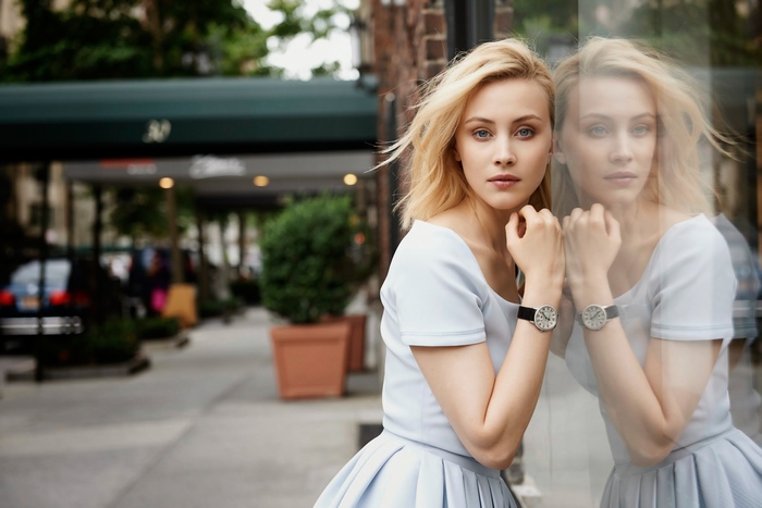 Sarah Gadon posing by a window