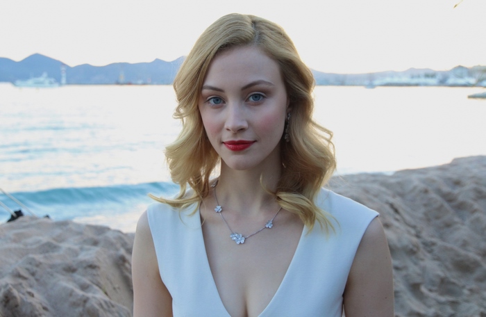Sarah Gadon on a beach