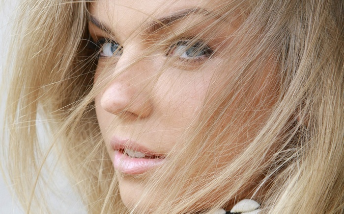 Close-up of a woman's face with blonde hair