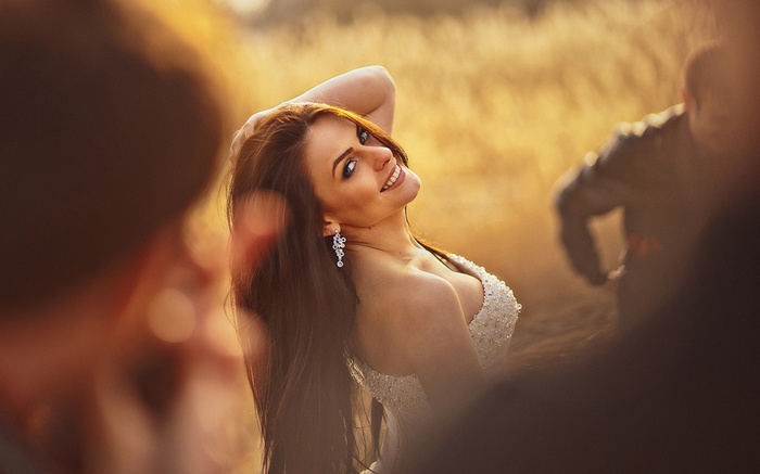 Woman in a white dress posing outdoors