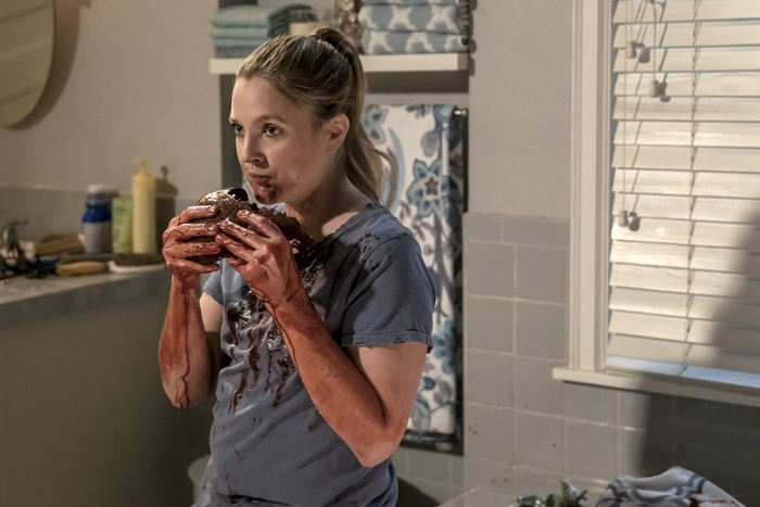 Drew Barrymore eating a bloody object
